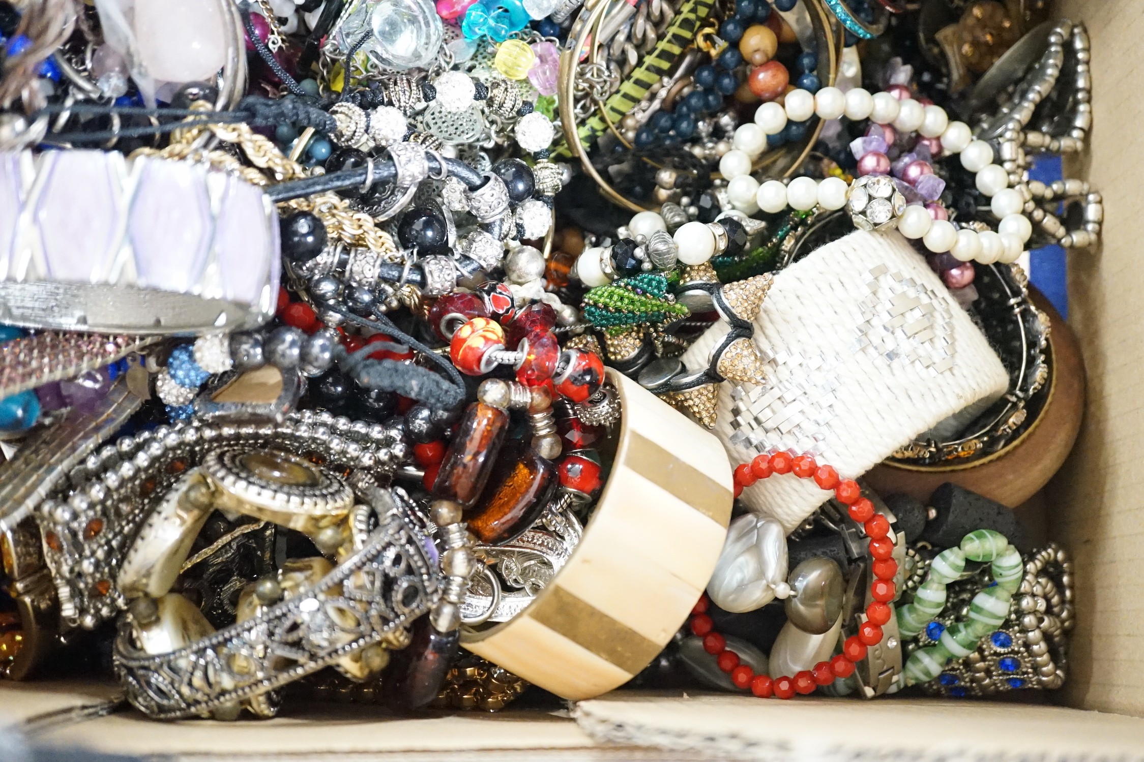 A large quantity of assorted bangles and other costume jewellery.